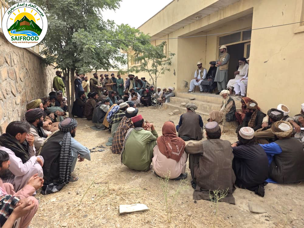 Flood-affected beneficiary completes registration before receiving emergency cash assistance from SUAO and Rebuild Aid in Badghis Province.