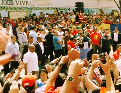 El Comandante with his fist to his chest at the crowd - this is where he came to vote
