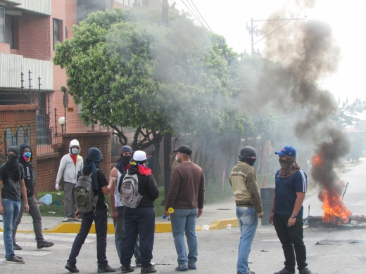 Opposition block roads with burning rubbish