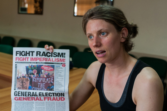 Samantha explains about the newspaper "Fight Racism, Fight Imperialism". Photo: Calixto N. Llanes