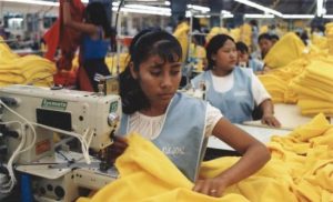 Women working in a garment factory (photo: marissaorton | CC BY-SA 2.0).