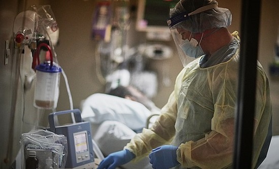 Doctor treats patient on ventilator