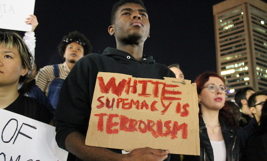 Anti Trump protest in Baltimore. Placard reads 'White supremacy is terrorism'