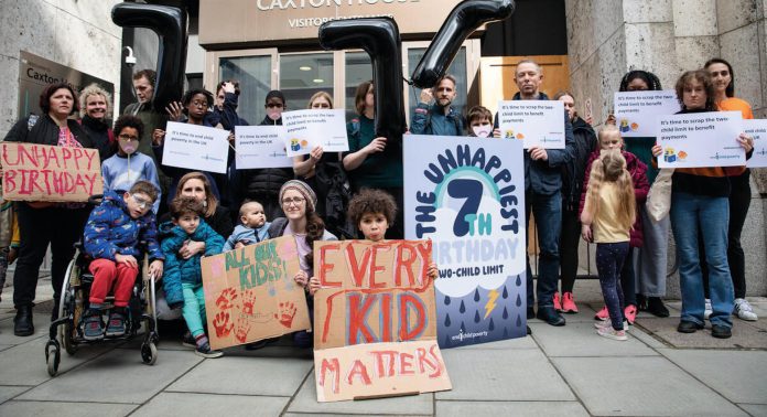 Protesters mark the 7th birthday of the two-child benefit cap