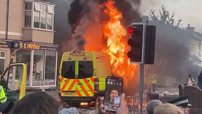 Van on fire during the 30 July 2024 Southport Riots