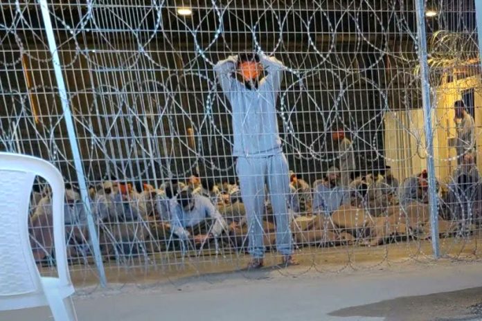 A leaked photo of Palestinian prisoners held in a detention facility at the Sde Teiman military base