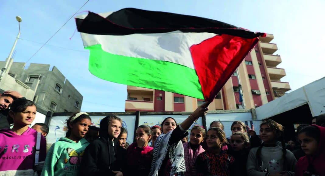 Palestinian children in Nuseirat refugee camp, Gaza celebrate the January 2025 ceasefire agreement