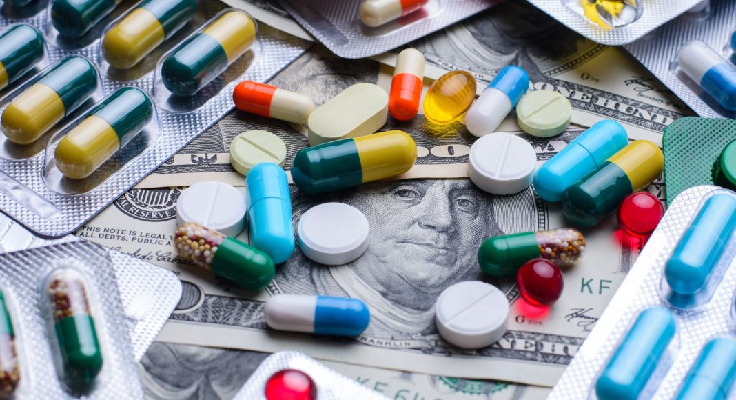 Prescription drugs on a money banknotes. Concept of healthcare costs
