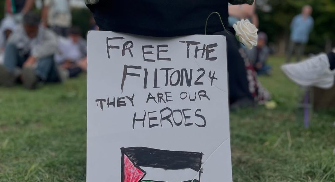 Placard reads 'Free the Filton 24 they are our heroes' above drawing of Palestine flag