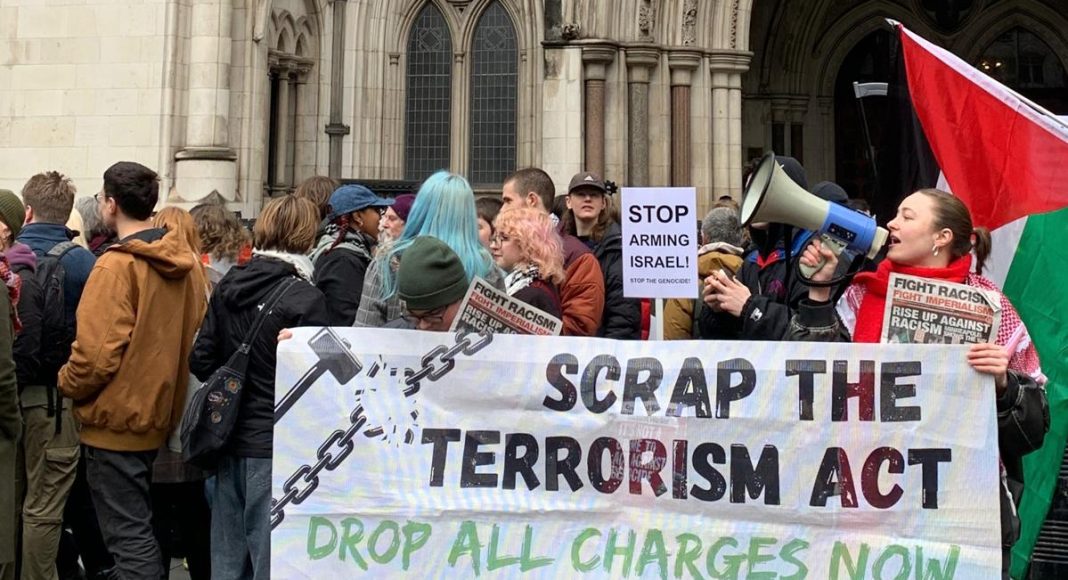 FRFI supporters protest outside the Royal Courts of Justice on 13 February as the outcome of the Judicial Review is announced. They hold a banner reading 'Scrap the terrorism act - drop all charges now' (photo: FRFI)