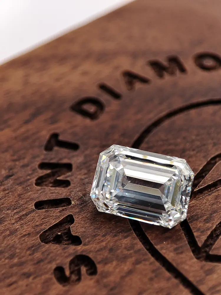 A colorless emerald cut memorial diamond.