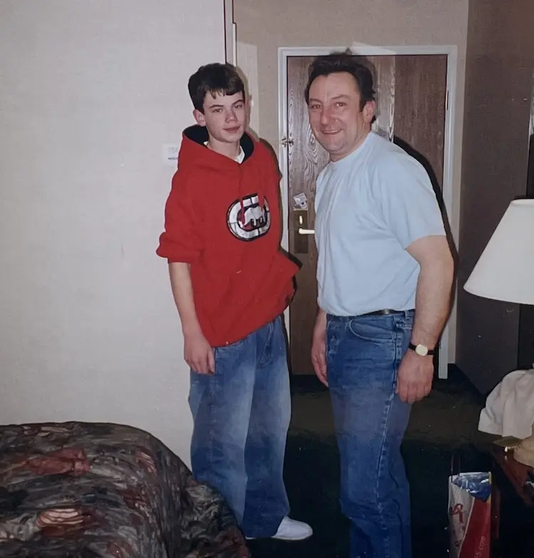 Father and son, posing for a picture.