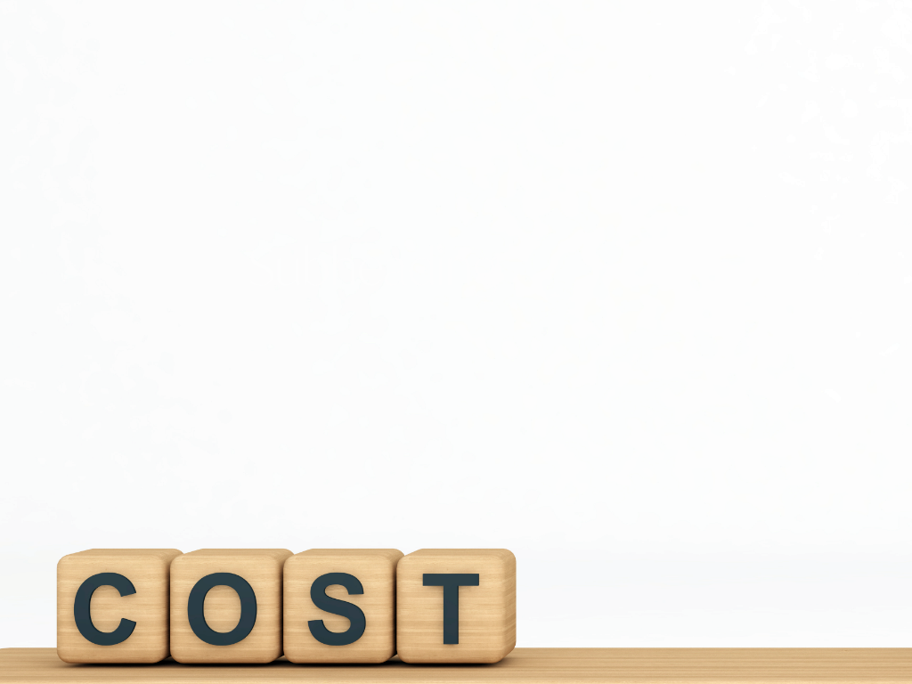 Cost Text Written On Four Light-toned Wooden Blocks