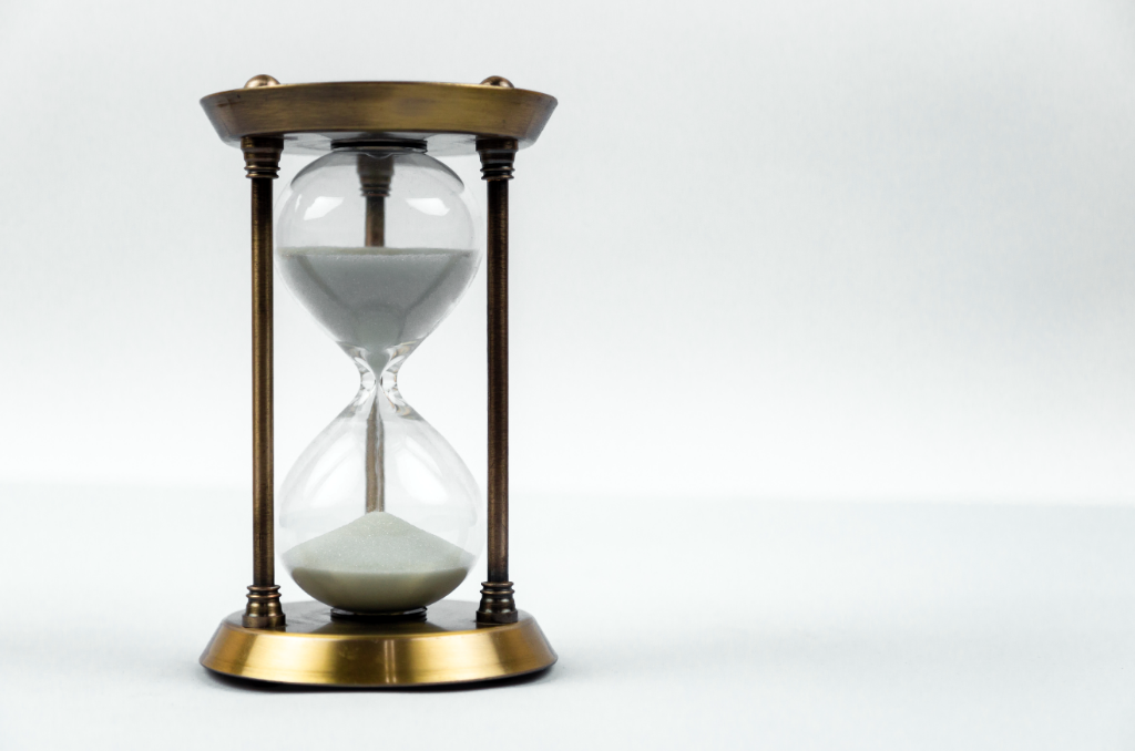 Old Vintage Style Hourglass On A White Background