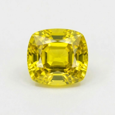 Yellow Chrysoberyl On A Gray Background