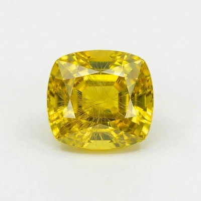 Yellow Demantoid Garnet On A Gray Background