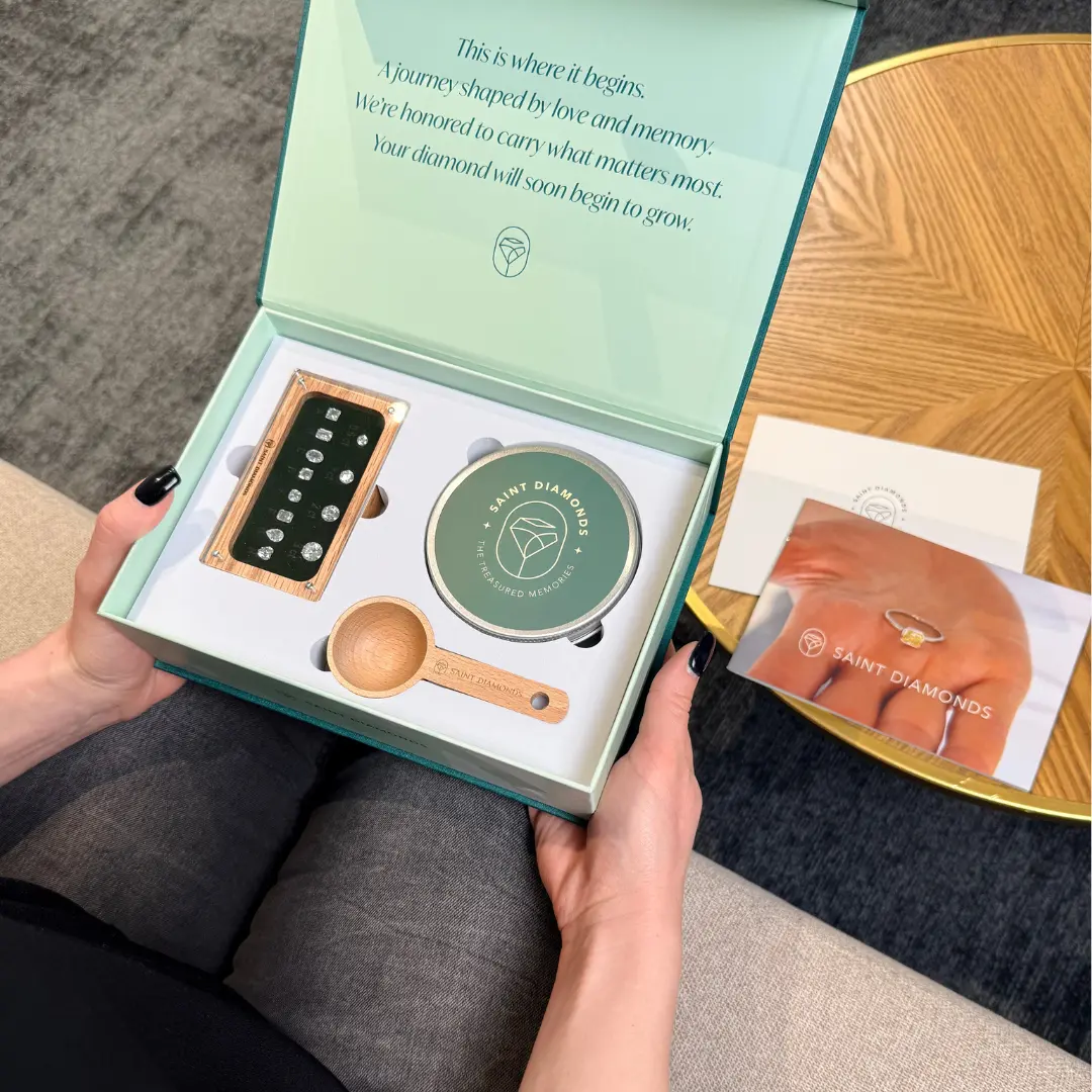 Hands opening the Saint Diamonds memorial diamond welcome kit