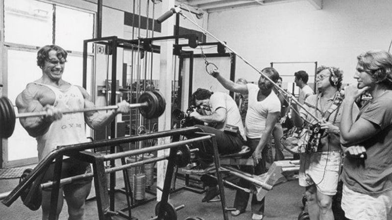 Arnold Schwarzenegger working out at Gold's Gym.