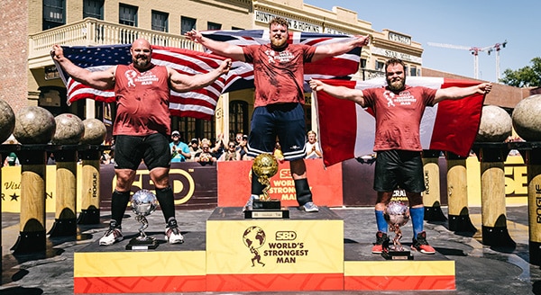 3 athletes on the podium of The World's Strongest Man competition.