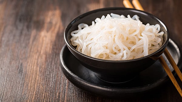 A bowl of konjac noodles with chopsticks.