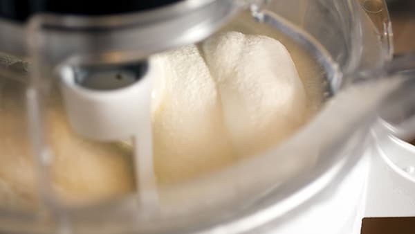 An ice cream being prepared in an ice cream maker.