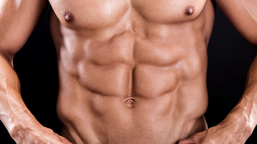 The chocolate bars of a shirtless man anxious to work his lower abs.