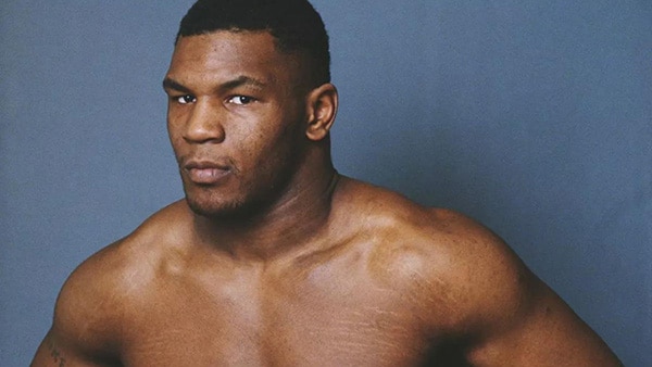 A photo of shirtless American boxer Mike Tyson.