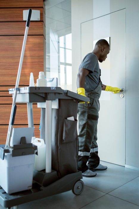 full-shot-man-cleaning-doorknob (1) full-shot-man-cleaning-doorknob (1)