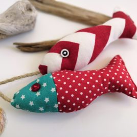 A pair of red fabric fish
