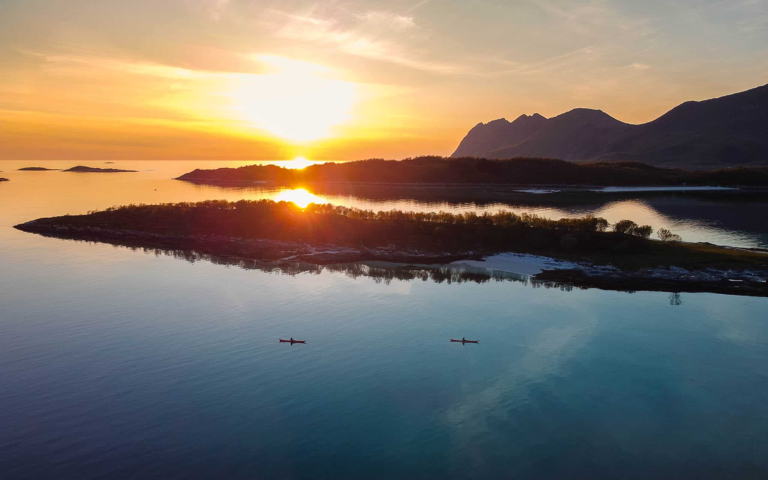 sea kayaker in between the islands of Bergsfjord in Senja Norway