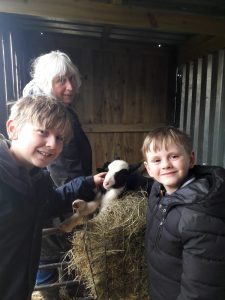 Sarah Bliss with Grandchildren in the lambing shed