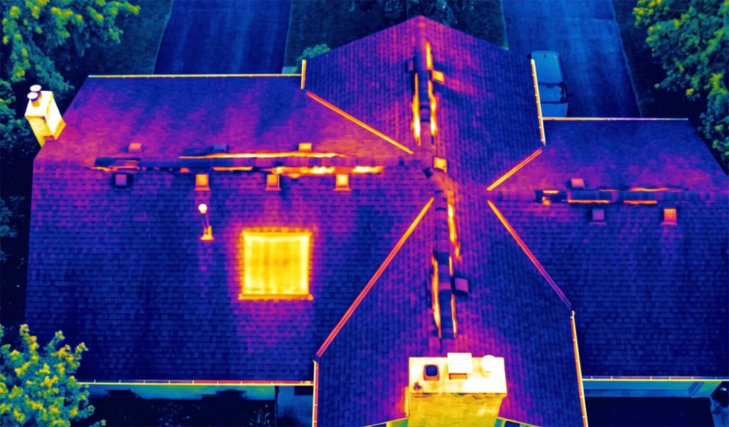 Infrared thermal imaging scan of a commercial roof highlighting heat loss and moisture retention areas by Sky Sight