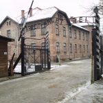 The "Arbeit macht frei" sign at the main gate of the Auschwitz I concentration camp in German-occupied Poland. Photo: Taken 27 November 2005 by Tulio Bertorini. (CC BY-SA 2.0).