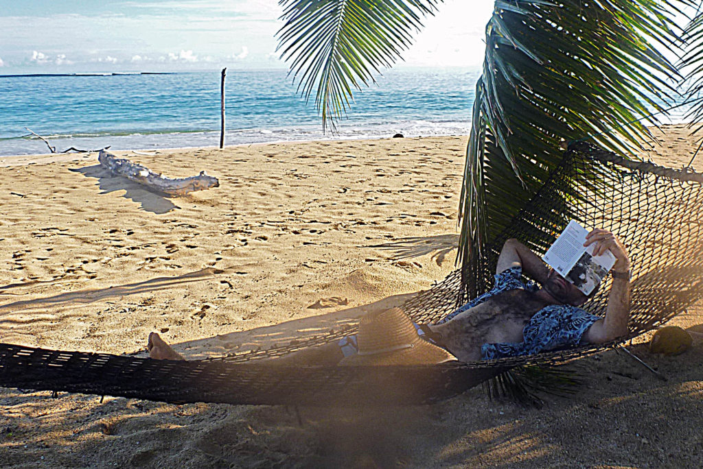 Relaxing on a secluded beach while enjoying Glamping Eexperience