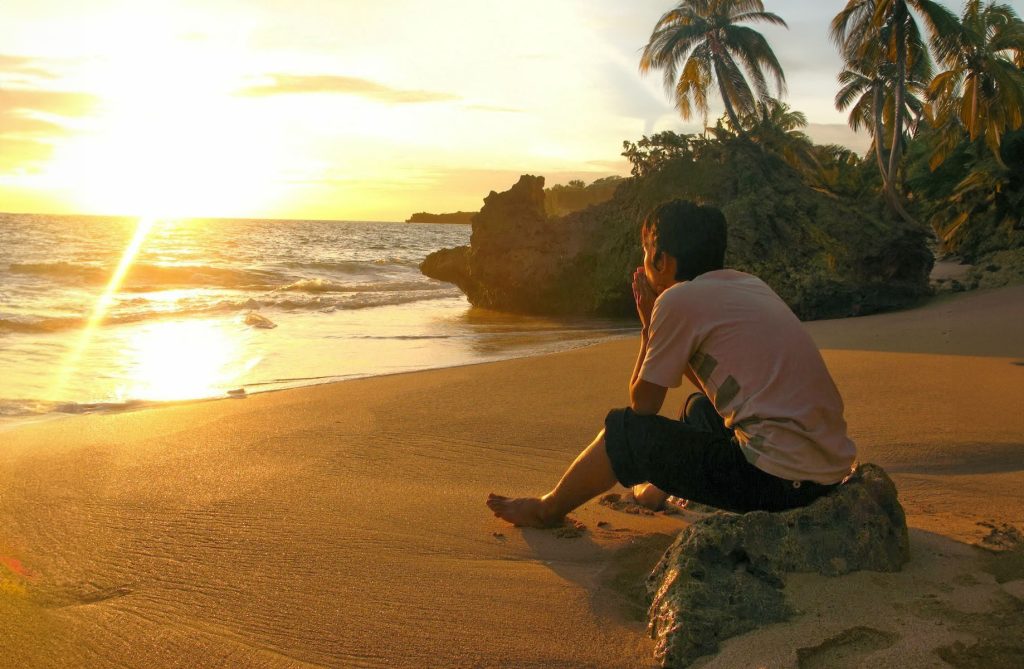 Lone man surviving on a desert island