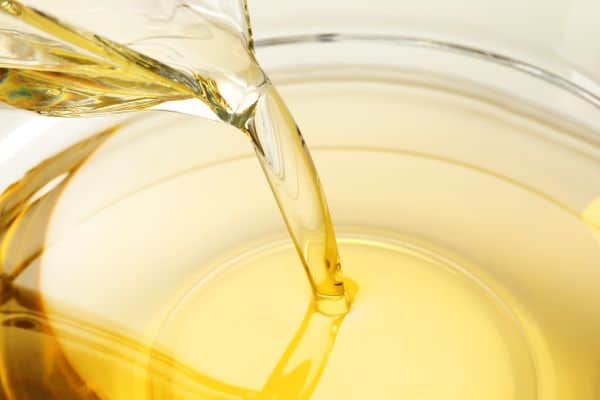 Pouring,Cooking,Oil,Into,Glass,Bowl,,Closeup Neutral HCF Vegetable Oil