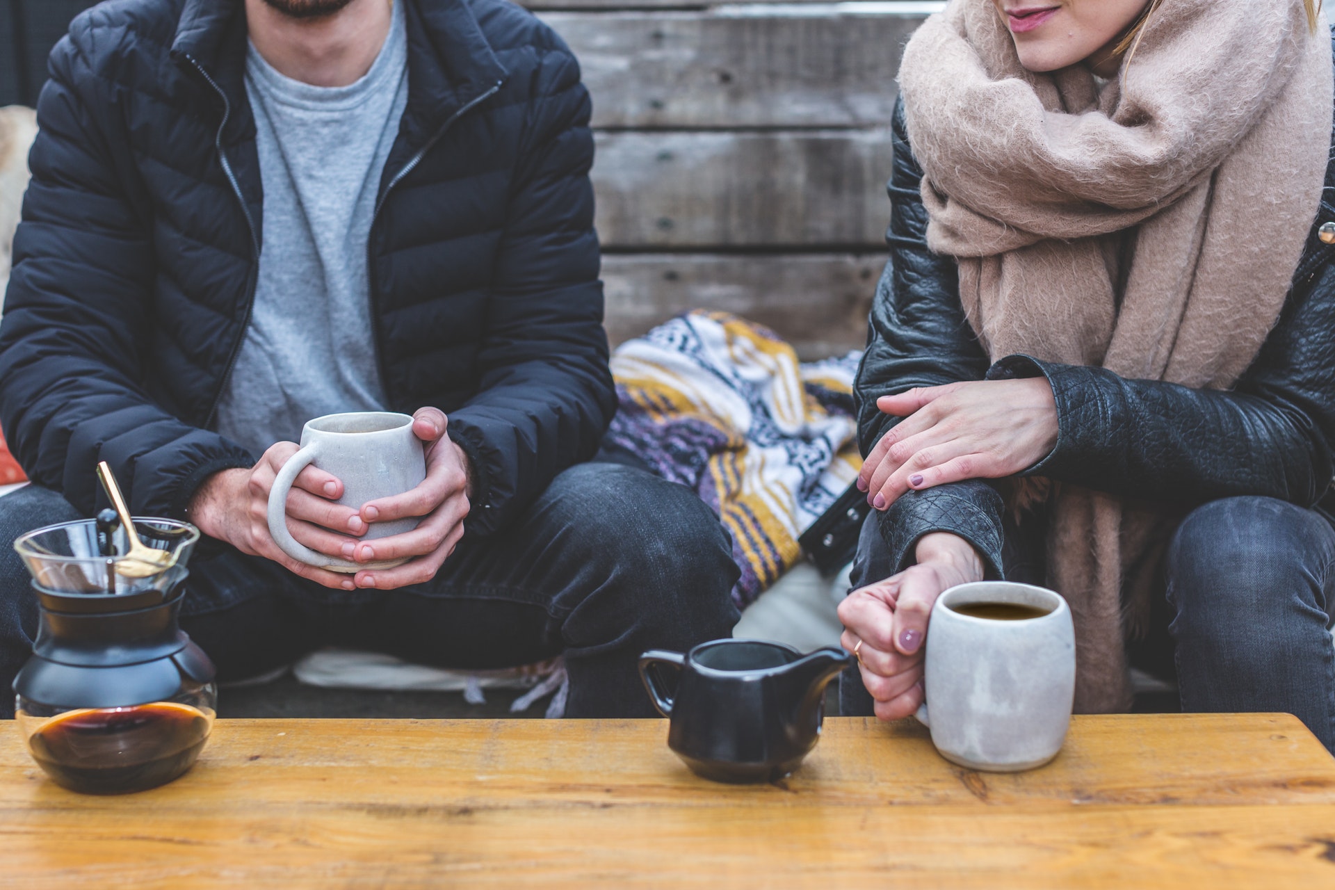 man and woman drinking coffee