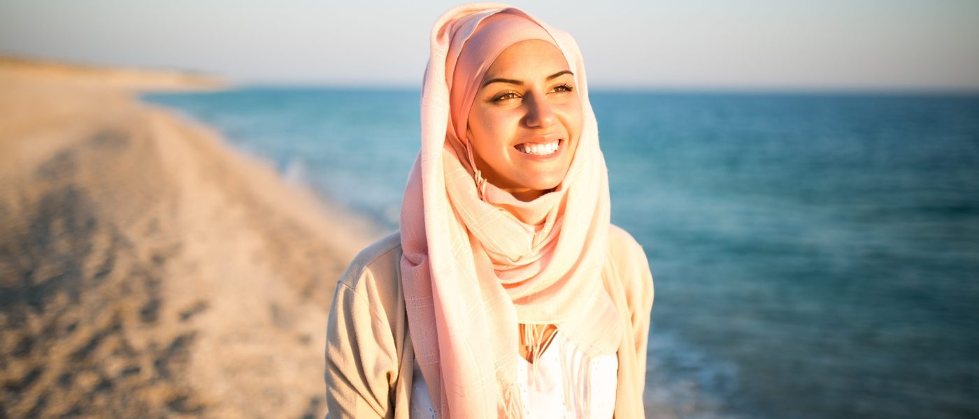Young beautiful happy muslim woman outdoors portrait.Seaside,bea