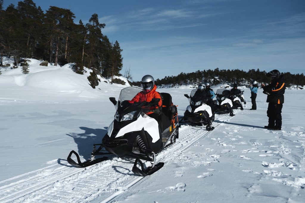 People on snowmobiles