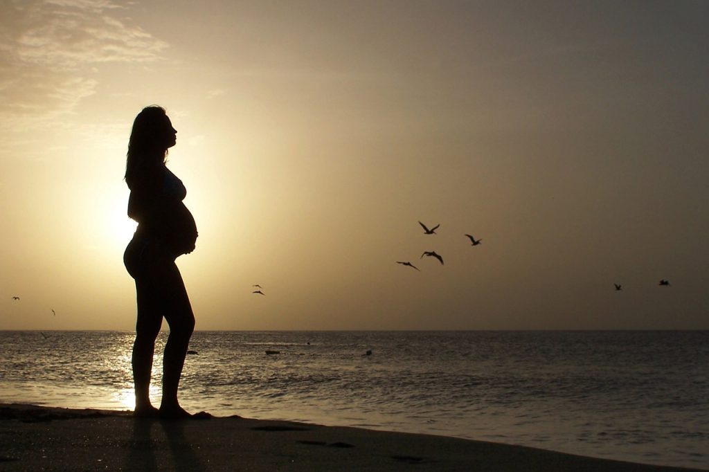 super doula, beautiful young, pregnant woman, in beach-1434863.jpg