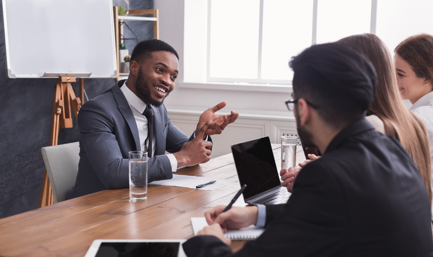 cheerful-african-american-applicant-talking-job-interview-hr-comission