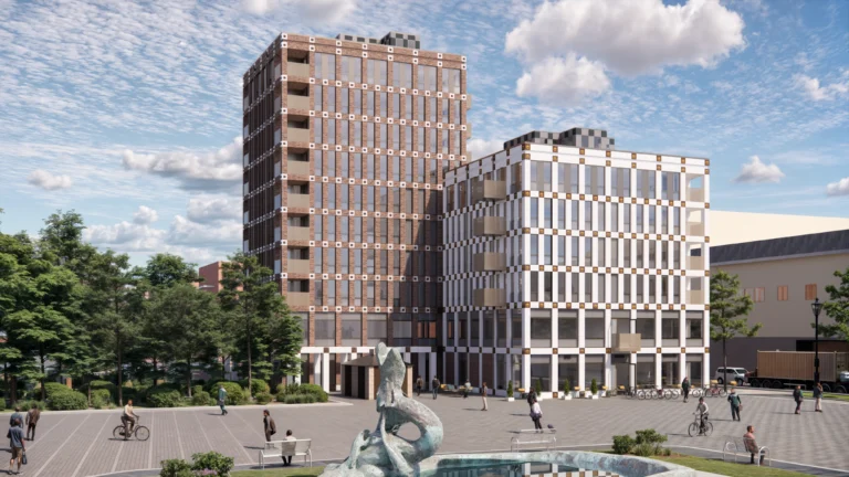 Illustration av den nya klinikbyggnaden i Trelleborg där Trelleborgs Tand & Implantatklinik planerar att flytta in, modern fastighet med flera våningar och stadsmiljö