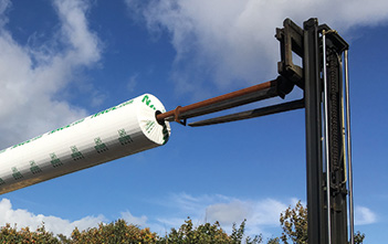 Nonwoven roll handled with a carpet pole