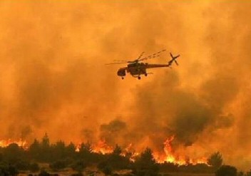 a-helicopter-above-a-fire