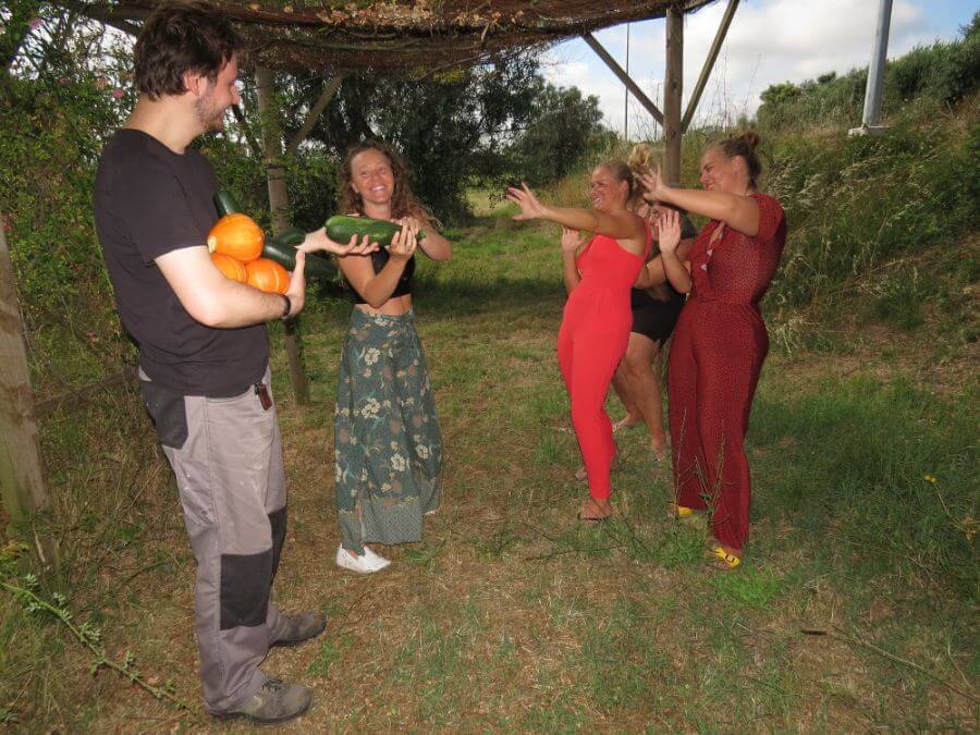 Broes offers zucchini and pumpkin to the girls