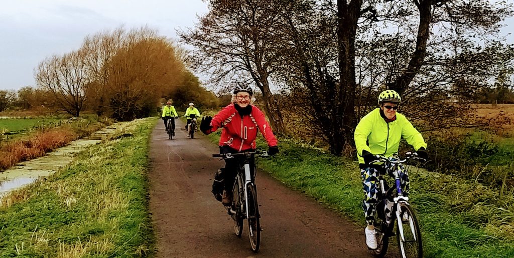 people cycling happily on a BACC organised ride