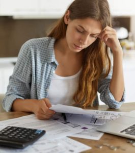 woman agonising over household bills