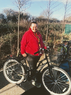 Charlotte smiling with her bike