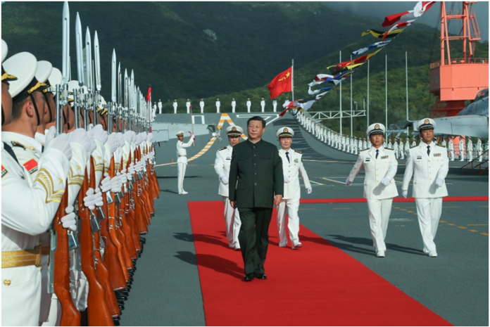 Xi Jinping boards the aircraft carrier Shandong and reviews the guard of honor at a naval port in Sanya, south China's Hainan Province