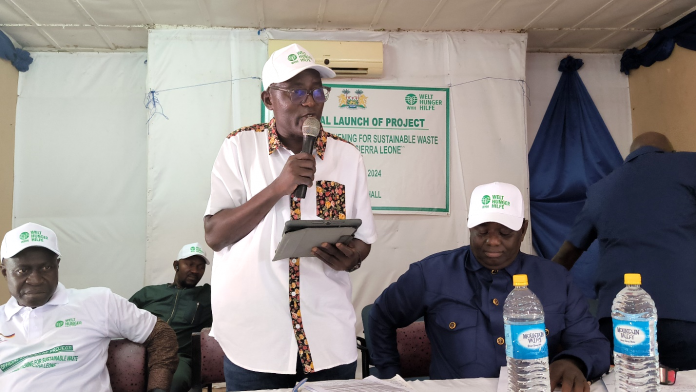 Deputy Minister of Local Government & Community Affairs- Alfred Moi Jamiru delivering the keynote address at the project launch in Makeni City